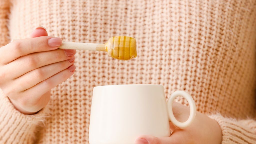 Adding honey to tea